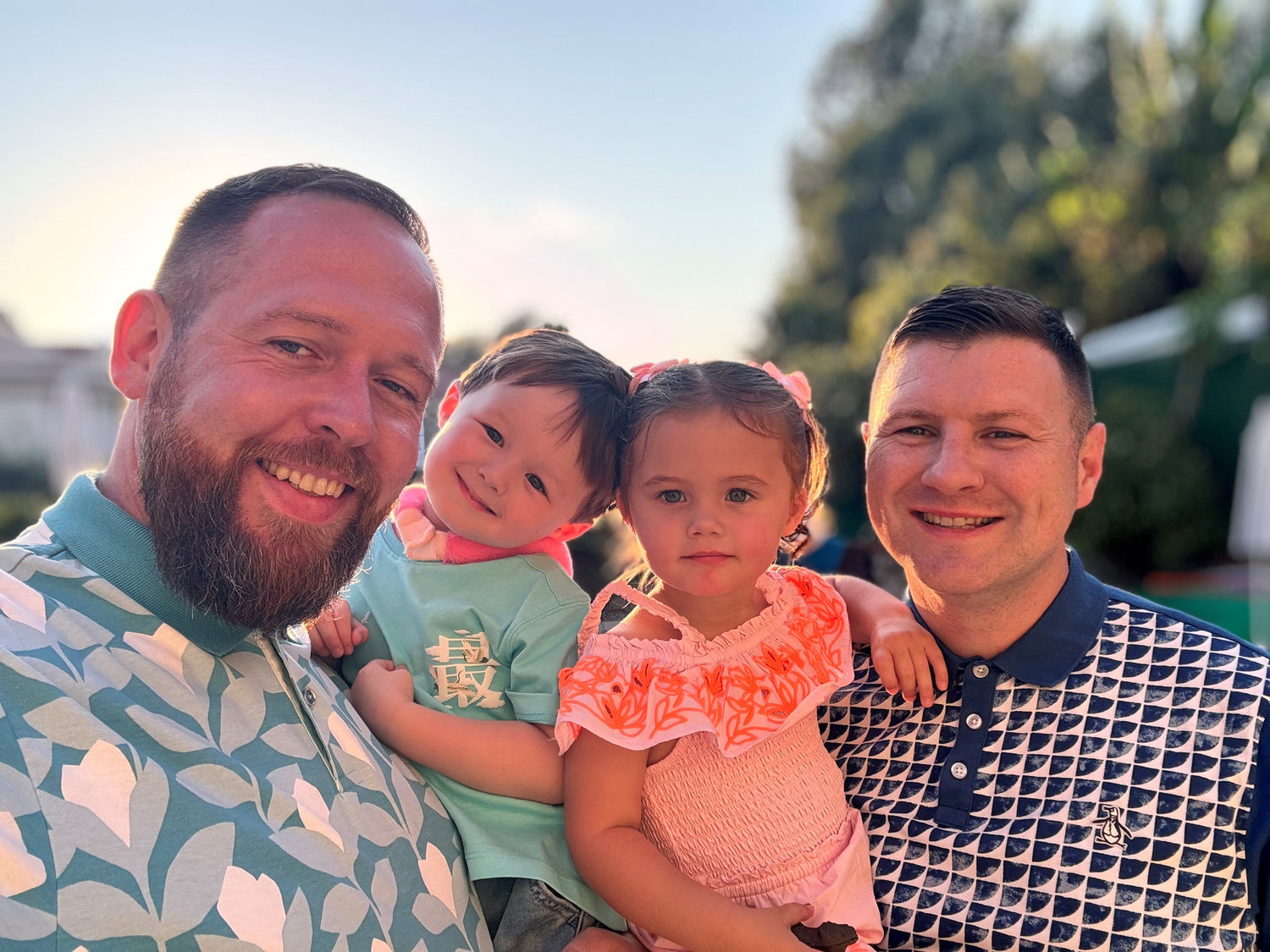 Two dads with their children